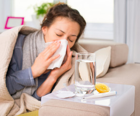 Fototapeta na wymiar Sick Woman. Flu. Woman Caught Cold. Sneezing into Tissue