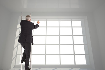 Fototapeta na wymiar Composite image of mature businessman climbing career ladder
