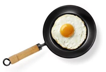 Selbstklebende Fototapeten fried egg in frying pan © MIGUEL GARCIA SAAVED