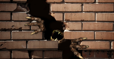 Paws of monster , breaking a brick wall © frenta