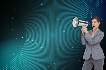 Composite image of businesswoman with loudspeaker