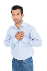 Portrait of a casual young man with chest pain