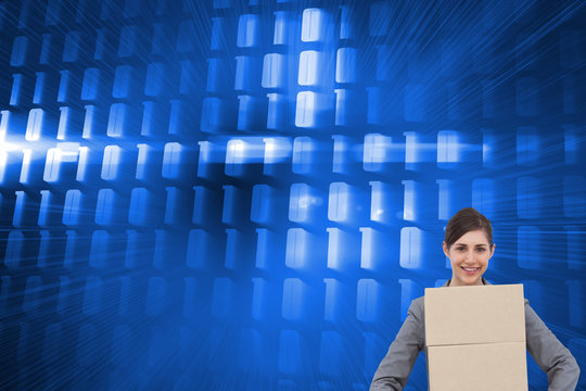 Composite image of smiling businesswoman carrying cardboard boxe - Powered by Adobe