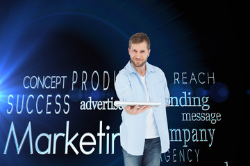 Composite image of happy man showing laptop to camera and smilin