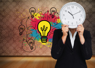 Composite image of businesswoman in suit holding a clock