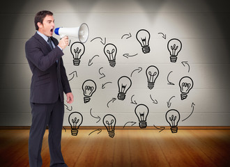 Composite image of standing businessman shouting through a megap