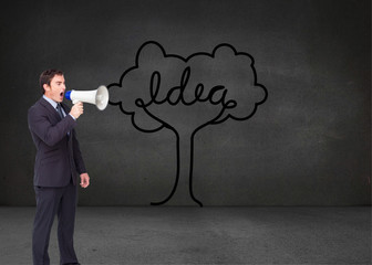 Composite image of standing businessman shouting through a megap