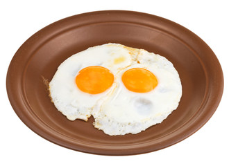 fried eggs on ceramic brown plate