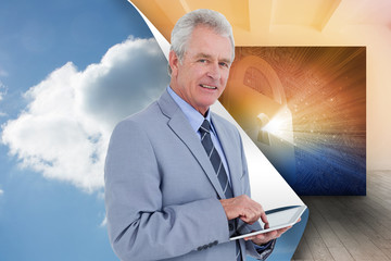 Composite image of side view of mature tradesman with tablet com