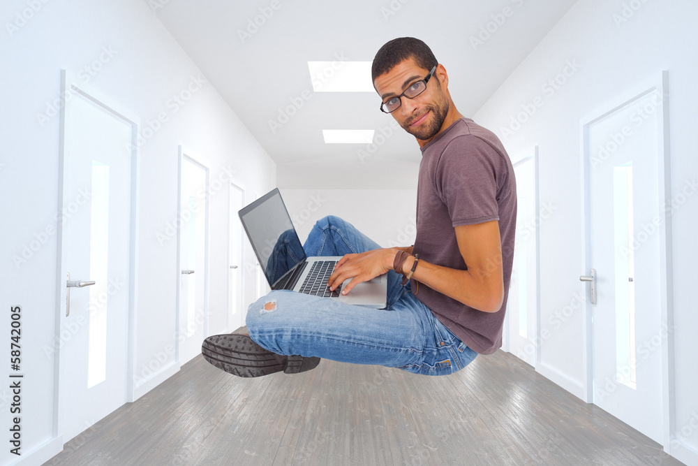 Poster composite image of man wearing glasses sitting on floor using la