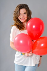 girl with red balloons in the studio Valentine's Day