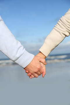 Closeup of senior people holding hands