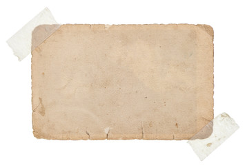 old grungy paper card with tape isolated on white