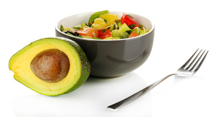 Tasty avocado salad in bowl  isolated on white