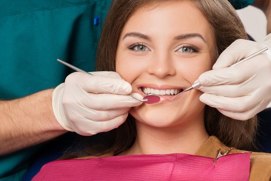 Young brunette woman at dentist's surgery