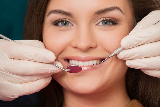 Young brunette woman at dentist's surgery