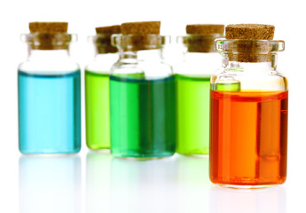 Bottles with basics oils isolated on white