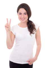 portrait of happy young woman giving peace sign isolated on whit