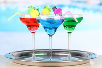 Different cocktails on bright background