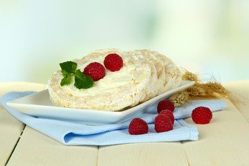 Tasty crispbread with berries, on white table