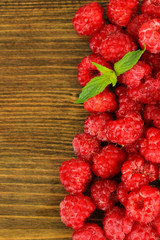 Fresh raspberry on wooden background