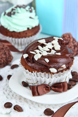Tasty cupcakes with gifts close up