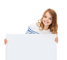 Fototapeta premium smiling little girl with blank white board