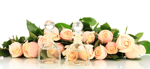 Beautiful bouquet of roses and perfume, isolated on white