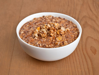 Oatmeal on wooden board. breakfast