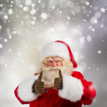 Authentic Santa Claus with real beard and great smiling giving t