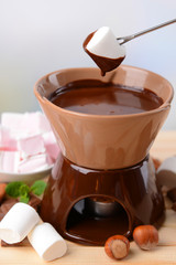 Chocolate fondue with marshmallow candies,