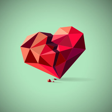 Broken heart consisting of triangles with pieces on a