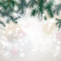 Fototapeta na wymiar carte de Noël : branches de sapin, neige, bokeh