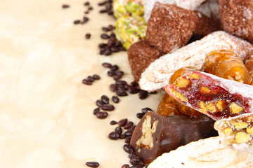 Tasty oriental sweets, on brown background