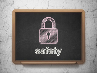 Privacy concept: Closed Padlock and Safety on chalkboard