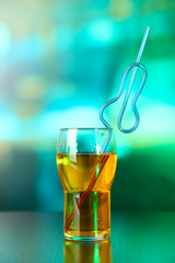 Glass of cocktail, on bright background