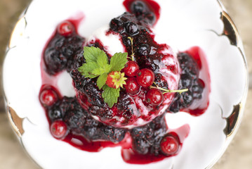 Creamy Panna Cotta with fresh berries and mint leaves