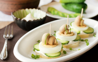 Vegetable appetizer skewers on white plate