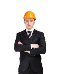 Portrait of businessman with arms crossed in helmet