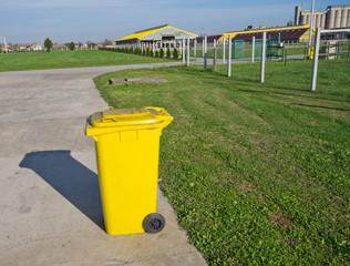 Trash can standing alone on modern cow farm
