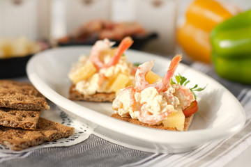 Snack of pineapple, shrimp and cheese