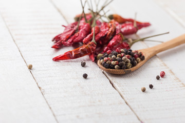Mixed pepper and chili on wooden background