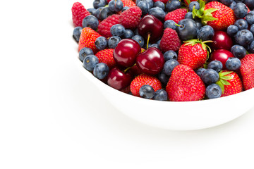 Close up of plate full of berries, isolated