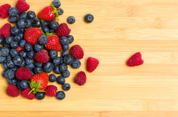 Close up of heap of berries on the table, isolated