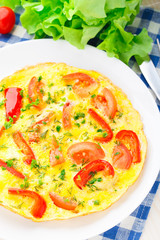 Omelet with paprika, tomato and herbs