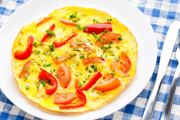 Omelet with paprika, tomato and herbs