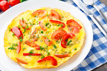 Omelet with paprika, tomato and herbs