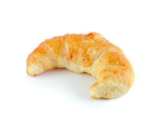 Fresh and tasty croissant over white background