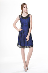 Fashion girl in fashion dress posing in the studio