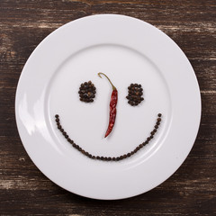 Happy smiley face on dish plate